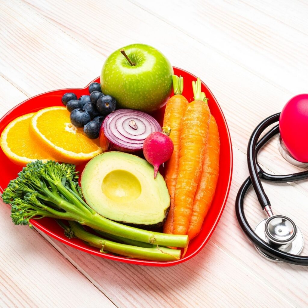 Fruits and veggies in heart-shaped bowl