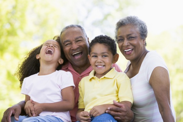grandparents laughing with grandchildren